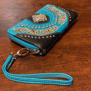 Western style money pouch. Teal and black.
